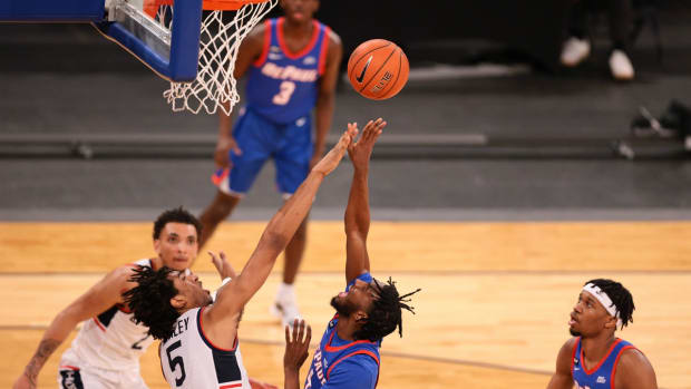 Mar 11, 2021; New York, NY, USA; DePaul Blue Demons guard Javon Freeman-Liberty (4) shoots the ball as Connecticut Huskies forward Isaiah Whaley (5) defends during the first half at Madison Square Garden. Mandatory Credit: Vincent Carchietta-USA TODAY Sports